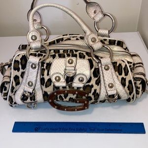 Guess animal print bag. Zipper top and 2 snap side pockets on outside end.
